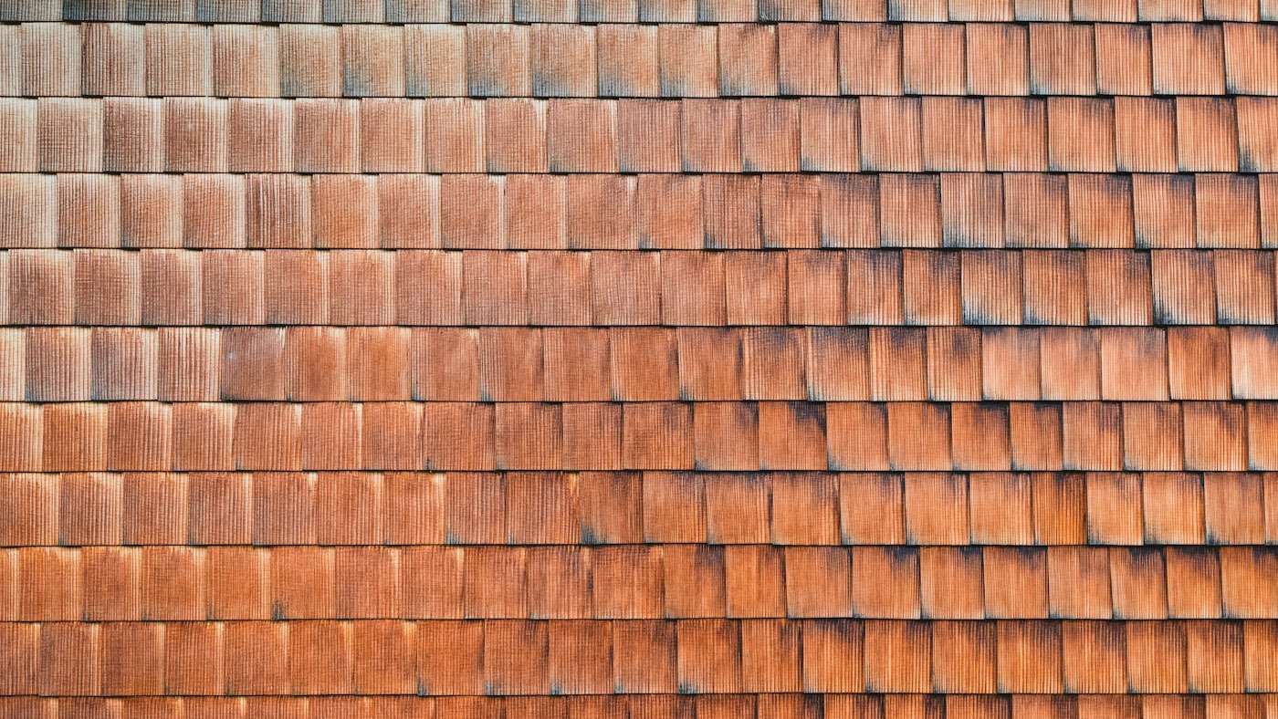 Freshly installed reddish-brown cedar shingles