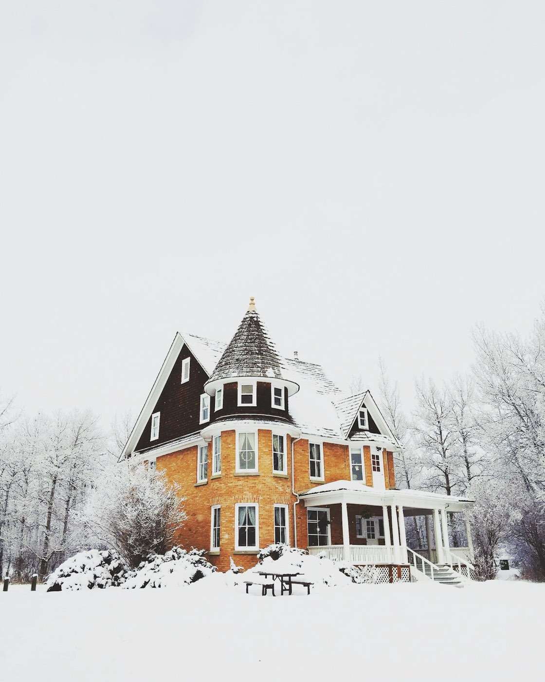 House surrounded by deep snow in winter